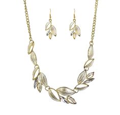 "Beautiful and timeless silver and gold color leaf necklace and earring set.  It is designed with silver enamel applied to the leaves and with a gold plating around each leaf.  It is mixed with marquise shape crystals set on some leaves.  It is light weight and comfortable to wear around the neckline.  A nice two tone silver and gold necklace set for everyday or and speial occasion.   The necklace length is approximately 17.5\" with a 3\" extender chain The finish is in gold tone plating The earrings are pierced Earrings are 1 5/8\" long Fast shipping. All items are securely packaged with extra bubble packing to avoid any damage in shipping.     Please contact us if you are not satified with any purchase so you can return it for a refund." Gold Leaf Shaped Metal Jewelry, Metal Leaf-shaped Jewelry, Leaf-shaped Metal Jewelry With Matching Earrings, Gold Plated Leaf-shaped Jewelry, Silver Leaf-shaped Necklace, Yellow Gold Metal Necklace With Matching Earrings, Silver Leaf-shaped Metal Jewelry, Gold Necklace Set, Necklace And Earring Set