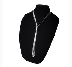 The liquid-like texture of the sterling silver cylinders  strung together by hand gives to this this lovely layering long necklace the flexibility to be worn long, wrapped or doubled up. Stylishly sleek, extra slick and easy to wear, is the versatile multi-way necklace your or her jewelry collection craves! Wear it lasso style or create custom layered looks. Check out pictures for ideas. Our Liquid Silver Necklace with 10 strands is a great gift idea for wives, moms, teachers, sisters or any oth Silver Lariat Chain Necklace For Layering, Silver Lariat Long Necklace As Gift, Silver Lariat Necklace For Party, Silver Lariat Long Necklace For Gift, Elegant Long Drop Silver Chain Necklace, Formal Silver Lariat Long Necklace, Silver Long Drop Lariat Necklace For Formal Occasions, Adjustable Silver Long Necklace For Formal Occasions, Silver Multi-strand Lariat Necklace Gift