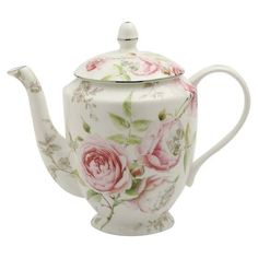 a white tea pot with pink roses painted on it