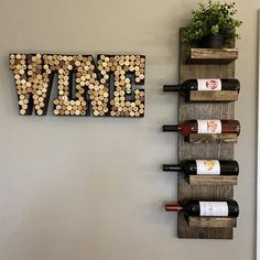 the wine rack is made out of wood and has several bottles on it, as well as a sign that says vine