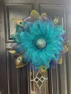 a blue flower with peacock feathers on it