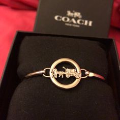 Coach Bracelet Still In Original Box Never Worn Other Than To Try On & Tag Was Taken Off Thinking I Would Keep It But Have Not Taken It Out Of The Box! Reasonable Offers Will Be Considered! Coach Metal Bracelet Jewelry, Coach Bracelets As Gift, Coach Adjustable Bangle, Adjustable Coach Bangle, Coach Metal Bangle Jewelry, Coach Bangle Bracelets Gift, Coach Round Jewelry For Anniversary, Classic Coach Jewelry For Gifts, Coach Silver Bangle Bracelets