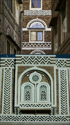 two different pictures of an old building and the same one has a window in it