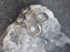 Silver Opal Earrings, Silver Moon Earrings, Silver Hoop Earrings, Celestial Earrings, Birthday Gift, Gift for Her These out of this world celestial crescent moons feature tiny cubic zirconia and opal starburst charms. For added sparkled the silver opal stars are framed with tiny cubic zirconia and small glowing synthetic opal stones. These cosmic earrings are the perfect gift for someone graduating, a best friend, celestial wedding or something special just for you! All of my jewelry arrives sui Celestial Small Hoop Nickel-free Jewelry, Celestial Style Small Hoop Nickel-free Jewelry, Celestial Metal Hoop Earrings Gift, Celestial Hoop Jewelry As Gift, Hypoallergenic Celestial Round Earrings, Celestial Silver Dangle Hoop Earrings, Celestial Silver Round Hoop Earrings, Silver Celestial Hoop Earrings, Celestial Hoop Sterling Silver Earrings