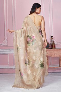 Elegant beige floral print Banarasi saree is a perfect drape for light festive occasions. It comes with a blouse piece. Disclaimer: The shown stitched blouse on the model is for display purpose only. The saree comes with a matching blouse piece and finished with fall and piko. Beige Silk Saree With Traditional Drape, Traditional Beige Silk Saree, Bollywood Style Beige Saree With Unstitched Blouse, Diwali Beige Traditional Drape Blouse Piece, Festive Beige Saree With Traditional Drape, Semi-stitched Beige Saree In Traditional Drape, Beige Semi-stitched Saree In Traditional Drape, Unstitched Beige Bollywood Saree, Beige Semi-stitched Anarkali Saree