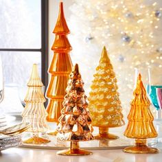 Colorful and elegant, our decorative glass Christmas trees come in a rainbow of coordinating hues.  

Set of 5 glass Christmas trees in assorted sizes.

#holidaydecor #homedesign
#homestyling

We find and curate, we style and bundle, and with one -click & we ship! Visit https://nestset.com/products/glass-christmas-tree-sets Tree Display Ideas, Eclectic Christmas Decor, Eclectic Christmas, Glass Christmas Trees, Latest Decorating Trends, Christmas Tree Pictures, Tree Display, Cody Foster, Playful Decor