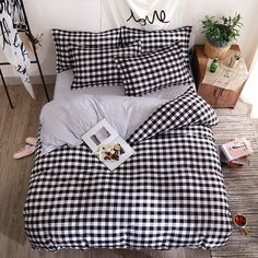 a black and white checkered comforter set on a bed