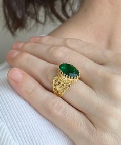 Gold Emerald Edwardian Silver Heart Ring, 925 Sterling Silver Green Quartz Gemstone Artisan Handmade Filigree Boho Women Statement Ring Dainty cocktail ring, boho wedding gift, victorian jewelry, gift ring for her, September birthstone, oval statement ring, ancient Egypt ring, birthday gift her, vintage gold ring, trendy women ring Material: 925 Sterling Silver with 18K Gold plated ( NICKEL FREE ) Gemstone: Emerald 10x14 mm. FREE, FAST AND TRACKABLE SHIPPING FOR ALL EU COUNTRIES AND USA. Elevate your elegance with the epitome of luxury - the Gold color Emerald Edwardian Silver Heart Ring. Crafted with precision and passion, this exquisite piece of jewelry is a testament to artisan craftsmanship and timeless beauty. Made from the finest 925 sterling silver, it showcases a resplendent green Oval Gemstone Heart Ring As Gift, Oval Gemstone Heart Ring For Gifts, Green Filigree Ring As Fine Jewelry Gift, Green Filigree Ring Fine Jewelry For Gift, Emerald Ring With Intricate Design Gift, Filigree Ring For May Birthstone Gift, May Birthstone Filigree Ring Gift, Emerald Filigree Ring Gift, Emerald Ring With Filigree For Gift