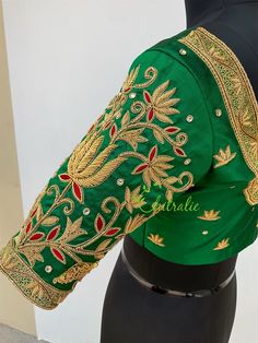 This is made to order/ custom made according to your requirements. Fabric - Pure soft silk Color - Dark green Princess Cut Padded Deep U shape neck front and back Front Hook Closure Half Sleeve Cotton lining An epitome of beauty, grace and elegance. Luxury bridal blouse is designed by our designer Lekha Meera. Beautiful zardozi work heavy bridal blouse. The lotus designs on the blouse gives it an elegant and unique look with it purity. It's handcrafted by trained artisans. We made it with love a Green Traditional Wear With Motifs For Reception, Green Traditional Draped Wedding Blouse, Ceremonial Green Choli With Zari Work, Green Art Silk Blouse For Wedding, Traditional Green Silk Blouse, Green Ceremonial Choli With Traditional Drape, Bollywood Style Green Blouse For Weddings, Green Silk Blouse For Reception, Green Fitted Saree For Ceremonial Occasions