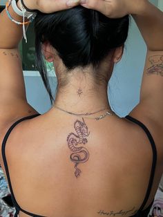 tattoo, tattoo idea, tattoo inspo, simple tattoo, back tattoo, dragon, dragon tattoo, North Star, star tattoo, tattoo placements Tattoo Ideas Inspiration, Spine Tattoo Ideas, Tato Minimal, Small Dragon Tattoos, Back Of Neck Tattoo, Neck Tattoos Women