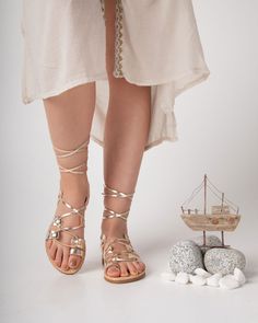 Gladiator leather women Greek sandals, gold lace up Spartan goddess sandals, handmade leather from the best cowleather from our Greek island Crete. The best summer shoes for women who want to stand out.The sole is lightweight you can enjoy miles of safety walk and sandal's soles will be always on shape. All of our products are handmade with the best and highest quality leather from our beloved island of ''Crete''. The leather used for each item may be irregular in terms of colour and texture due Gold Ankle Strap Lace-up Sandals For The Beach, Gold Lace-up Sandals With Single Toe Strap, Gold Bohemian Open Toe Sandals, Gold Ankle Wrap Sandals For Beach, Gold Ankle Wrap Barefoot Sandals For Summer, Bohemian Gold Sandals With Round Toe, Gold Lace-up Sandals For Beach, Gold Lace-up Sandals With Round Toe For Beach, Gold Lace-up Sandals With Round Toe For Vacation