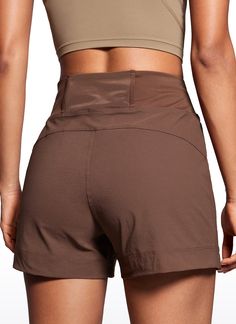 the back view of a woman in brown shorts