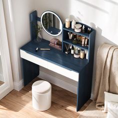 a blue and white desk with a mirror on it