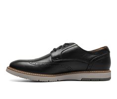 Riding the line between dress and casual, the Florsheim Vibe Wingtip Oxford features a classic style with a cool wedge sole. Worn with chinos or jeans, thanks to its combination of modern style and Flexsole Technology, the Vibe will have you feeling and looking great. Smooth Rich Leather upper, Lace up closure for secure fit, Approx. 1\ slightly wedged sole, Wingtip Toe with brogue detailing, Fully cushioned footbed, Flexsole Technology™ for natural motion and flexibility, Full-length rubber out Casual Black Oxfords With Brogue Detailing, Casual Moc Toe Dress Shoes For Business, Casual Business Dress Shoes With Moc Toe, Casual Black Dress Shoes For Business Casual, Casual Dress Shoes For Business Casual In Spring, Spring Casual Dress Shoes For Business Casual, Casual Black Oxfords With Contrast Sole, Casual Wingtip Dress Shoes For Work, Casual Oxford Dress Shoes For Work