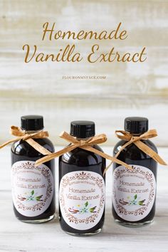 three bottles of homemade vanilla extract on a table