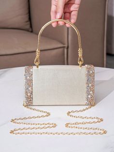 Add a glamorous touch to any party or wedding with our Elegant Rhinestone Clutch Bag. This stunning bag is designed with shimmering rhinestones and is perfect for any event. Elevate your style with this must-have accessory that will make you stand out from the crowd. Color : Champagne Details : Rhinestone Magnetic : Yes Strap Type : Chain Bag Size : Mini Style : Glamorous Pattern Type : Plain Closure Type : Magnet Type : Square Bag Material : Satin Composition : 100% Polyester Care Instructions Glamorous Rhinestone Bags For Prom, Bedazzled Rectangular Evening Bag For Parties, Glamorous Embellished Bags For Prom, Glamorous Evening Bedazzled Bags, Glamorous Bedazzled Evening Bags, Embellished Clutch Bags For Prom, Elegant Sparkling Bags For Prom, Bedazzled Gold Bags For Wedding, Gold Bedazzled Bags For Wedding