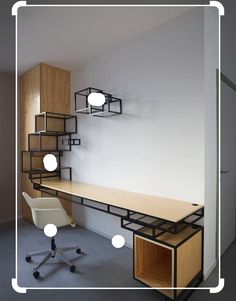 a room with a desk, chair and shelving unit on the wall next to it