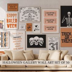 a living room filled with lots of halloween posters on the wall above a white couch