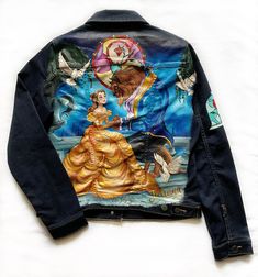 a jean jacket with an image of a woman in a ball gown on the back