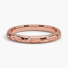 a rose gold wedding band with diamonds