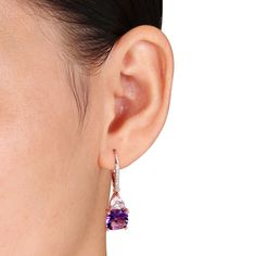 Enhance your already-beautiful look with these enchanting gemstone drop earrings. Crafted in sterling silver with rose rhodium plate, each colorful earring highlights an 8.0mm cushion-cut bright purple amethyst topped by an upside-down 5.0mm heart-shaped Rose de France amethyst. Dazzling diamond accents adorn the graceful ear wire to complete the choice. Buffed to a brilliant luster and sure to be adored, these earrings secure with lever backs. Luxury Rose Gold Earrings With Gemstone Accents, Formal Rose Gold Earrings With Gemstone Accents, Dazzling Rose Gold Sterling Silver Earrings, Sterling Silver Drop Earrings With Gemstone Accents, Rose Gold Earrings With Gemstone Accents, Elegant Purple Earrings With Prong Setting, Elegant Rose Gold Earrings With Gemstone Accents, Elegant Purple Earrings As A Gift For Her, Elegant Purple Earrings For Her