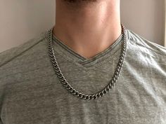 Strong, solid, and universal. This 7mm 316L stainless steel curb chain is the everyday necklace you haven't been able to find. Layer it over tees or under dress shirts to hint at your inner edginess. Whether you're surfing, sleeping, showering, riding, or dressing for an event, it requires no maintenance or babying. To achieve a continuous look, this necklace clasps directly onto the last link of the curb chain. The oversized clasp makes for easy closure. Find a choker version of this chain here Cheap Sterling Silver Curb Chain Necklace, Affordable Sterling Silver Curb Chain Necklace, Diamond Circle Necklace, Simple Chain Necklace, Copper Chain Necklace, Gold Necklace Simple, Mens Gold Jewelry, Long Silver Necklace, Necklace Clasps