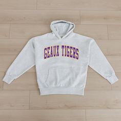 Bring the energy of the game to your wardrobe with our Lsu Tigers oversized premium weight hoodie with ribbed cuff and waistband. Be the ultimate Lsu Tigers fan with this versatile and trendy item. Lsu Clothes, Madi Prewett, Lsu Outfits, Gameday Couture, Geaux Tigers, Ny Giants, Lsu Tigers, Jacksonville Jaguars, Team Apparel