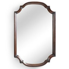 a mirror that is on the wall with a wooden frame and wood trimmings