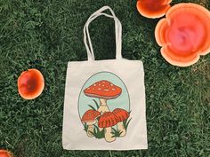 "Embrace the charm of whimsy and nature with our 'Retro Mushroom' Canvas Tote Bag! Made of durable 100% cotton canvas, this 15x16-inch tote features an adorable lil' red mushroom illustration, perfect for enthusiasts of mushroom motifs and nature lovers who adore exploring the great outdoors. The natural undyed cotton adds to the rustic cottage-core aesthetics, making it an ideal companion for your foraging adventures or a stroll through enchanted forests. Key Features: 100% cotton canvas tote, Vintage Canvas Gift Bag, Vintage White Cotton Shoulder Bag, Vintage Beige Cotton Canvas Bag, Beige Vintage Cotton Canvas Bag, Retro Canvas Bag As A Gift, Retro White Canvas Bag, White Retro Tote Canvas Bag, Retro White Canvas Tote Bag, Vintage White Canvas Bag For Everyday Use