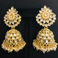 Kundan Pearl Jhumka/ Golden Kundan Jhumka/ Sabyasachi Kundan Earring/ Indian Punjabi Jhumka/ Wedding Earrings/ Bridesmaid Kundan Jhumka Features Traditional Kundan Jhumka Handcrafted To Perfection Light Weight Jewelry Perfect For Indian Weddings And Celebrations A Beautiful & Memorable Gift for Weddings and Special Occasions 22k gold plated jewelry Length: 2.85 Inches Click here to see the complete collection of Kundan and Polki Statement Earrings at AryaFashions: https://www.etsy.com/shop/AryaF Punjabi Jhumka, Kundan Jhumka, Earring Indian, Light Weight Jewelry, Golden Earrings, Earrings Bridesmaid, Kundan Earrings, Indian Weddings, Fantasy Jewelry