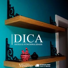 two wooden shelves sitting next to each other on top of a blue wall with the words dica above them