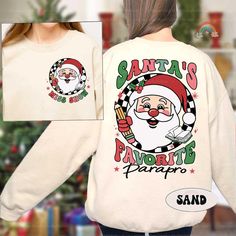 Paraprofessional Christmas Shirt Santa's Favorite Parapro, Christmas Parapro Sweatshirts, Teacher Aide, Para Team, Parapro Christmas Gifts ↓ Click here to view our additional fashionable collections ↓ https://handcraftedbyhelenn.etsy.com Product Details: - 100% Cotton (fiber content may vary for different colors) - Medium fabric (5.3 oz/yd2 (180 g/m2)) - Classic fit - Tear away label - Runs true to size Care instructions: - Machine wash: warm (max 40C or 105F); - Non-chlorine: bleach as needed; - Tumble dry: Medium - Do not iron; Do not dry clean ● Please choose your preferred style, size, and color from the dropdown menu or leave us a message in the "notes to seller" section. ● We are committed to processing and shipping your items as quickly as possible, but please note that custom print Paraprofessional Shirts, Teacher Aide, Teachers Aide, Christmas Shirt, Christmas Shirts, Cotton Fiber, Custom Print, Care Instructions, Christmas Gifts