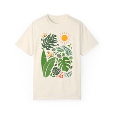 Favorite Outdoor tshirt, featuring tropical leaves and plants. Celebrate the outdoors with this rainforest inspired jungle leaf super-soft and high quality tee that just gets better with time. Great for plant lovers, conservation and environment, Make a statement and love it! Size up for over-sized fit, see chart for details. .: The Comfort Colors 1717 tee is made with medium fabric (6.1 oz/yd² (206.8 g/m consisting of high quality, 100% ring-spun US cotton for long-lasting comfort. .: The relaxed fit keeps the wearer comfy in both casual and semi-formal settings while the crew neckline delivers that classic, neat style which makes it perfect for accessorizing.  .: The pre-shrunk fabric ensures a consistently great fit. Check all available sizes in our Comfort Colors 1717 size chart.   S M Cotton T-shirt With Tropical Print, Cotton Tropical Print T-shirt, Botanical Plants Print Relaxed Fit T-shirt, Tropical Graphic Print T-shirt For Vacation, Botanical Relax Fit T-shirt With Plant Print, Botanical Plants Print T-shirt With Relaxed Fit, White Tropical Print T-shirt For Vacation, Botanical Short Sleeve Graphic Shirt, Botanical Relaxed Fit T-shirt With Plant Print