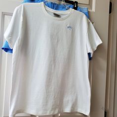 Basic White Tee Shirt With Blue Nike Logo Underarm Across The Front 22" Nike Cotton Shirt With Relaxed Fit, Relaxed Fit Cotton Nike Shirt, Nike Cotton Tops Relaxed Fit, Nike White Cotton Shirt, Nike Cotton Short Sleeve Tops, Nike Cotton Short Sleeve Shirt, Basic Nike Cotton Tops, Basic White Nike Top, Nike Cotton Summer Shirt