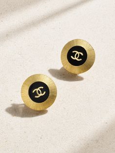 Chanel's vintage earrings date back to 1995, proving their enduring and timeless design. Sourced by Susan Caplan and in near-mint condition, they're cast from gold-plated metal and have glossy enamel centers with the iconic 'CC' emblem. The halo of ribbing reflects the light softly, while clip fastenings ensure they're comfortable whether your lobes are pierced or not.   This Chanel item has been authenticated by Susan Caplan. Susan Caplan is not affiliated or endorsed by Chanel. Vintage Chanel Earrings, Vintage Chanel Jewelry, Flat Dress Shoes, Room Fragrances, Chanel Earrings, Raffia Bag, Chanel Jewelry, Fashion Jewelry Earrings, Fine Jewelry Designers