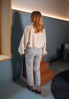 Pale-light yellow long sleeve collared shirt that features chic blue stripes while offering a flowy-comfortable fit. The perfect versatile and classy shirt that you can style up or down no matter the season or occasion. Our model also wears the Light Blue Maddie Jeans. Sizes: S-M / M-L S-M: Length 23.23 in - Width 22.44 in M-L: Length 24.41 in - Width 23.23 in 86% Rayon - 12% Polyester - 2% Nylon Washing: handwash only Spring Oversized Blouse With Striped Collar, Oversized Blouse With Striped Collar For Spring, Casual Long Sleeve Blouse With Striped Collar, Spring Long Sleeve Blouse With Striped Collar, Spring Blouse With Striped Collar And Long Sleeves, Long Sleeve Blouse With Striped Collar For Day Out, Striped Long Sleeve Blouse For Daywear, Chic Long Sleeve Blouse With Striped Collar, Spring Striped Relaxed Fit Blouse