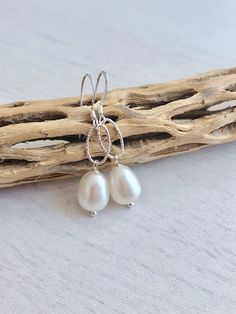 Pearl Earrings, June Birthstone, Freshwater Pearl Dangle Earrings, Minimalist White Pearl Jewelry in Gold or Silver, Pearl Drops Mom Gift These simple and delicate earrings feature oval nugget white freshwater pearls wire wrapped and suspended from Gold Filled or Sterling Silver oval links. These are classy, dainty and minimalist earrings but their glowing pearly color makes them stand out in the crowd. Ideal gift for a classic girl who loves pearls. Perfect bride earrings or bridesmaids earring Minimalist Teardrop Pearl Drop Dangle Earrings, Minimalist Teardrop Dangle Earrings With Pearl Drop, Minimalist Pearl Drop Teardrop Earrings, Minimalist Hypoallergenic Teardrop Pearl Earrings, Minimalist Teardrop Pearl Earrings With Ear Wire, Everyday Teardrop Dangle Earrings With Pearl Drop, Everyday Dangle Teardrop Earrings With Pearl Drop, Elegant Adjustable Teardrop Earrings With Pearl Drop, Everyday Pearl Drop Dangle Teardrop Earrings