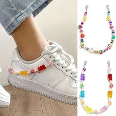 a woman's foot wearing white sneakers and colorful beaded bracelets with flowers on them