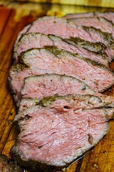 some meat is sitting on a cutting board