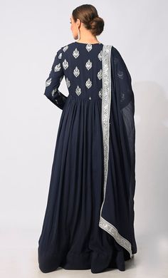 Introducing our exquisite Floor Length Anarkali, adorned with intricate foil and zari embroidery motifs meticulously crafted to adorn the entire bodice and sleeves, exuding an opulent charm that is sure to captivate attention. Designed to flatter your figure, the Anarkali features waist gathers that enhance your silhouette, allowing the fabric to drape elegantly and accentuate your natural curves. The gathers add volume and movement to the garment, ensuring you command attention with your gracef