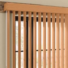 a window with wooden slats and blinds on it