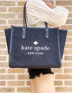 Style: Kate Spade Ella Large White Logo Shoulder Tote Handbag Material: Denim Fabric with Smooth Leather Trim Features: Interior Zip Pocket, 8.5" Double Shoulder Strap Drop, Zip Closure, Protective Bottom Studs, Fabric Lining Measures: 16.8" W x 11.2" H x 6.8" D Awesome Kate, Ella Tote, Bridal Clutch, Bags Logo, Fashion Videos, Kate Spade Purse, Large Shoulder Bags, Chanel Deauville Tote Bag, Tote Handbag