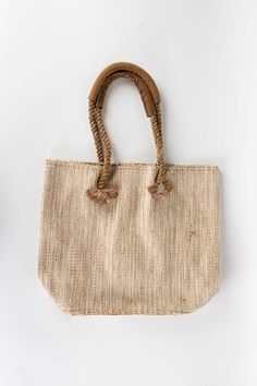 Everyday beach day, running errands, or date night—take your essentials with you in style in this handcrafted Jute & Cotton Tote with Leather Handles. Handmade with natural cotton, jute, and leather by artisans with Prokritee in Bangladesh. Bohemian Beach Bag For Everyday Spring Use, Everyday Neutral Handwoven Straw Bag, Beach Bag In Natural Fiber For Beach Season, Handmade Burlap Bags For Summer, Casual Summer Burlap Straw Bag, Summer Burlap Straw Bag For Everyday, Burlap Straw Bag For Beach In Summer, Summer Beach Burlap Straw Bag, Fair Trade Jute Straw Bag For Beach