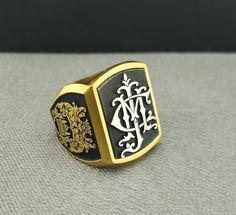 "Your custom solid sterling Silver ring will be made on your order, customize this Coat of Arms and your logo on this collection! A beautiful symbol that will fit your hands and style. perfect gift for anniversary, special dates and any date you can imagine can be Personalized. Different colors are silver, gold, rose gold. White gold and 24K gold options will never tarnish and last decades. Please contact me if you are interested in my jewelry. >ABOUT ME: I have 35 years of experience in making custom handmade silver and gold jewelry, including custom engraved Signet rings My childhood kind of allowed me to live among precious metals and gems pretty much I opened my workshop back in 1986 Never got bored of making Personalized gifts, birth flower rings, engagement rings with real diamonds F Gold Ring For Men, Family Crest Rings, Ring Logo, Ring Name, Beautiful Symbols, Gift For Anniversary, Name Ring, Signet Rings, Name Rings