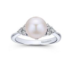 Classic cultured Pearl ring with six (.18ct total weight ) brilliant white diamonds set in 14k white gold. .18 ct Diamonds 14k White Gold Size 6.5, May be sized Made in USA Pearl Ring Design, Estate Jewelry Rings, Daith Jewelry, Cultured Pearl Ring, Pearl Fashion, Pearl Engagement Ring, Pearl Rings, Pearl And Diamond Ring, Septum Jewelry