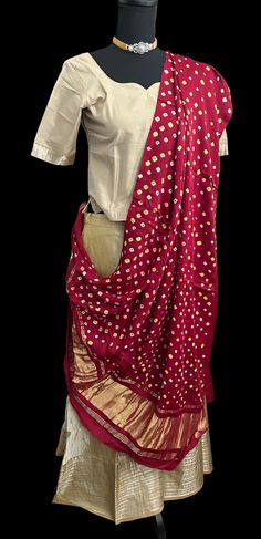 Pure Mangalagiri Silk Cotton Lehenga with pen kalamkari silk cotton Dupatta. Silk Cotton Lehenga with zari borders. Lined skirts and blouse , double lined. Color : beige  Fits ages -9 years to 12 years  Blouse size : length 18 inches  blouse chest - 32 goes upto 34 sleeve length -10 sleeve around - 14 Skirts - 39 inches long hip size 32 inches  Duppatta: pen kalamkari hand painted  silk dupatta Fitted Kalamkari Print Sets For Puja, Unstitched Cotton Silk Choli For Festivals, Fitted Chanderi Dupatta With Kalamkari Print, Festive Kalamkari Anarkali Set With Traditional Drape, Festive Kalamkari Print Anarkali Set, Fitted Traditional Wear With Kalamkari Print For Puja, Fitted Kalamkari Traditional Wear For Puja, Unstitched Kalamkari Sharara For Diwali, Fitted Cotton Silk Dupatta With Kalamkari Print