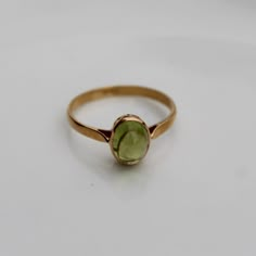 > Material - 18K Solid Yellow Gold > Gemstone - Peridot > Gemstone Shape - oval > Gross weight - 2.0 grams > Number of stone - 1 piece You can also go to my shop Home for more: https://www.etsy.com/in-en/shop/SilverAppeal FEEDBACK Please Leave A Positive Feedback Along With A 5 Star Rating On Your Purchase. A Satisfied Customer Is Our Top priority And Your feedback forms The Back Bone Of Our Success. We Are Committed To Maintaining A High Standard Of Serves To Our Customers. Kindl Oval Peridot Ring In Yellow Gold, Oval Yellow Gold Peridot Rings, Classic Green Opal Ring In 14k Gold, Classic Green Oval Stackable Rings, Gold Oval Peridot Birthstone Ring, Gold Gemstone Ring For May Birthstone, Gold Rings With May Birthstone Gemstone, Yellow Gold Stackable Rings With Peridot, Yellow Gold Rings With May Birthstone