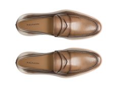 The Lalo showcases Magnanni's take on a sophisticated dress hybrid. This dapper slip-on features a traditional penny loafer design in supple calfskin leathers. The sleek dress silhouette is complemented with a comfortable and cushioned white rubber sole, making it the ideal selection for an on-the-go lifestyle. Luxury Leather Sole Slip-ons For Business Casual, Luxury Formal Wingtip Slip-ons, Luxury Goodyear Welted Slip-ons For Formal Occasions, Luxury Slip-on Dress Shoes For Business Casual, Luxury Calf Leather Slip-ons For Formal Wear, Elegant Semi-formal Goodyear Welted Slip-ons, Elegant Leather-lined Slip-ons For Business, Elegant Semi-formal Slip-ons With Leather Lining, Elegant Slip-on Dress Shoes In Calf Leather