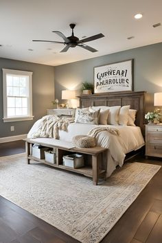 a bedroom with a bed, dresser and ceiling fan