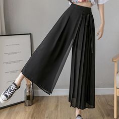 Get the best of both worlds when wearing our Venise Skirt Pants. The comfort of pants comes with the beauty of a skirt for a two-in-one stunning piece. The chiffon fabric adds to its comfortable feel allowing it to stay breathable and wearable in cold or warm climates. Wear these pants for a fashionable day out with friends when you want to dress to impress. Specifications Length: 3/4 Closure: Elastic Waist Front-Style: Pleated Material: Polyester Features: Pockets Fit: Loose Fit Style: Palazzo Japanese Pants, Hakama Pants, Samurai Pants, Overalls Plus Size, Hippie Dresses, Japanese Outfits, Japanese Fashion, Chiffon Fabric, Pants Outfit